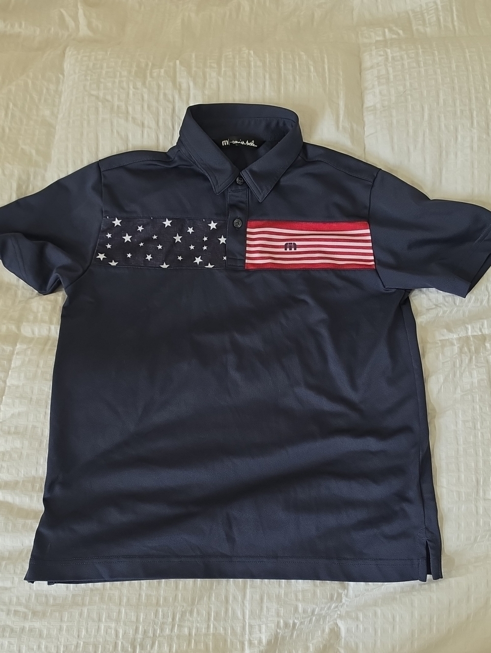 Travis Mathew Navy Polo with Red & White Flag Panels